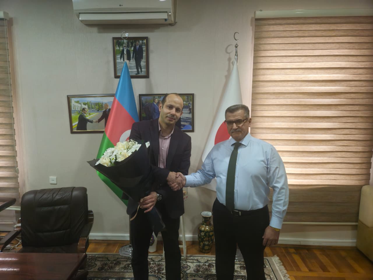  The president of the Azerbaijan Red Crescent Society, Dr. Novruz Aslanov congratulates the deputy executive secretary/head of the “Migration” department, Mammad Ketanov, on his birthday